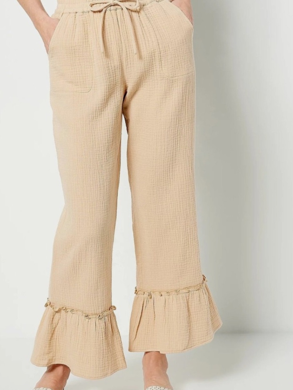 Beige Sand Flounce-Hem Cropped Pants in Beige, White and Black.
